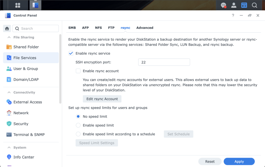 A screenshot of the Synology Control Panel in the "File Services" section under the "rsync" tab. The "Enable rsync service" checkbox is checked, with the SSH encryption port set to 22. Options to manage rsync accounts and speed limits are also visible.